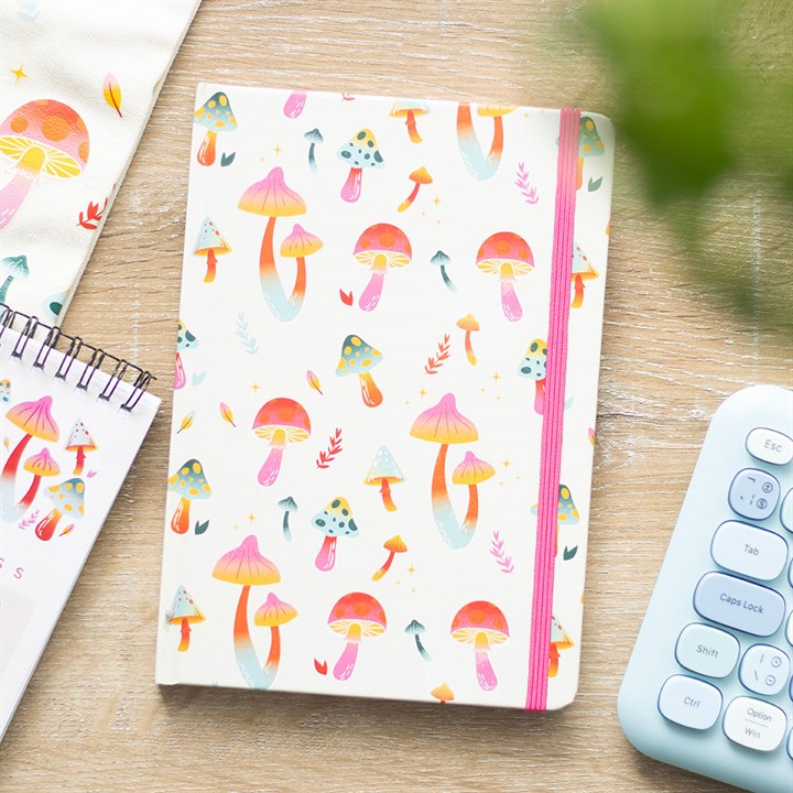 Add a touch of whimsy to your stationery collection with this "Funky Fungi" notebook! Featuring a vibrant, mushroom-themed design and an elastic closure, itÕs perfect for jotting down your thoughts, ideas, or doodles. Whether for school, work, or journaling, this quirky notebook is a must-have for mushroom lovers and anyone who adores playful, colorful vibes.