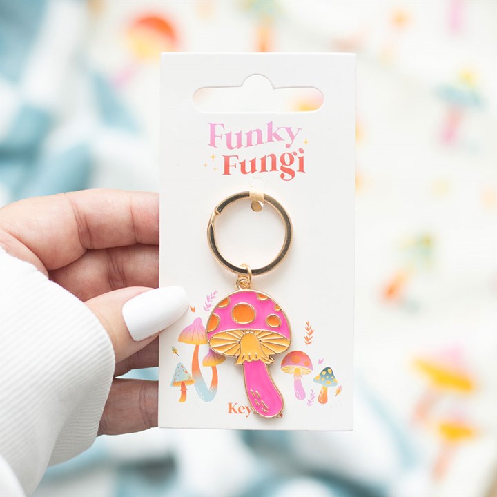 Add a pop of playful charm to your keys with this "Funky Fungi" keyring! Featuring a vibrant, pink mushroom design with golden accents, itÕs the perfect accessory for mushroom lovers, cottagecore fans, and anyone who adores quirky, colorful details. Lightweight and durable, this keyring is a stylish way to keep your keys handy while showcasing your fun personality!